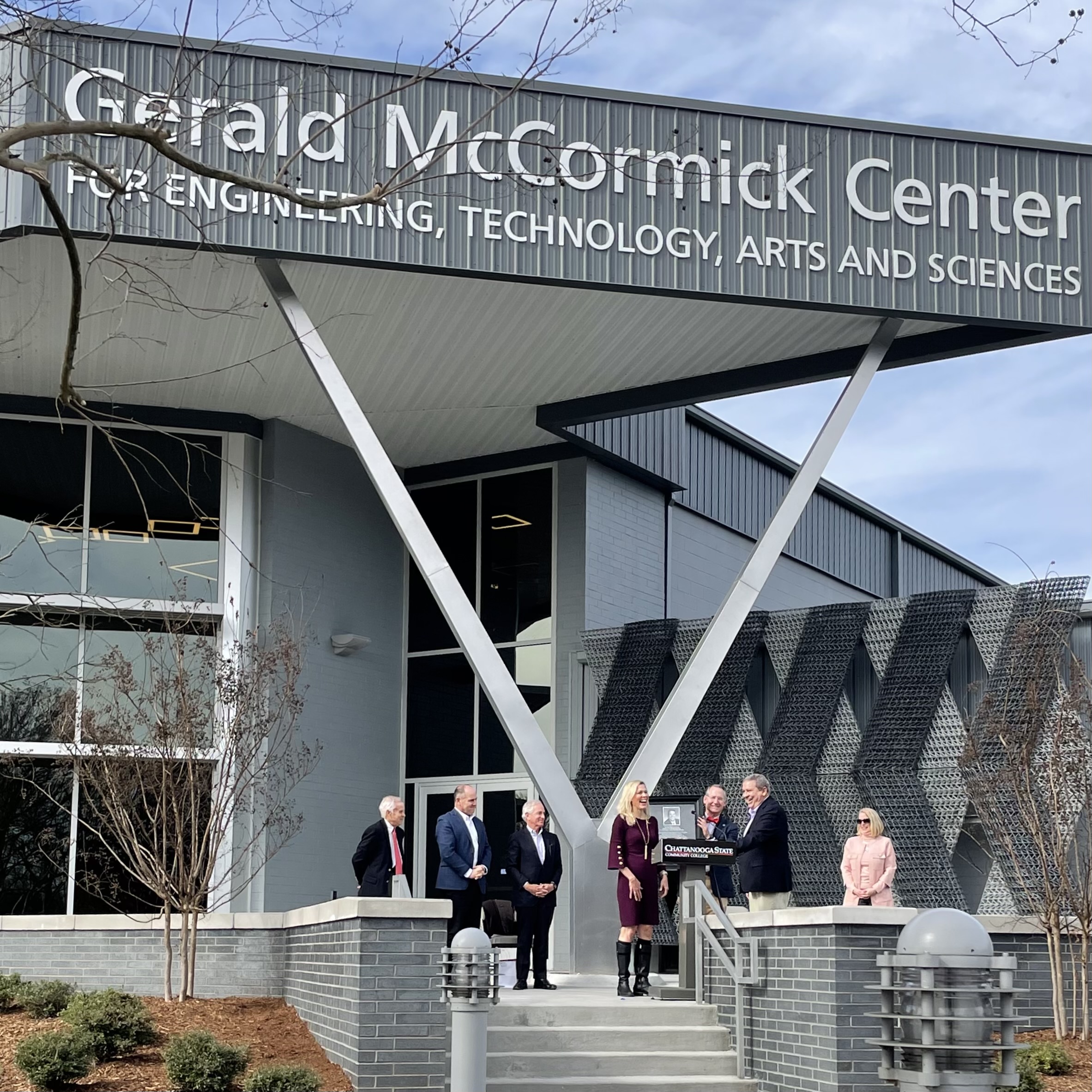 Dr. Rebecca Ashford presents Leader Gerald McCormick with a framed copy of the permanent plaque at the conclusion of the naming ceremony.