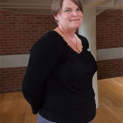 Interim Vice President Amanda Bennett poses in front of stairwell of the CBIH building.