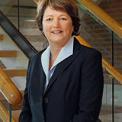 Vice President, Student Affairs Debbie Adams poses in front of stairwell of the CBIH building.