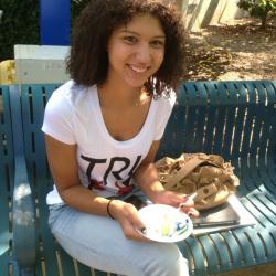 Tn Promise student enjoys a piece of 50th Birthday cake for the college