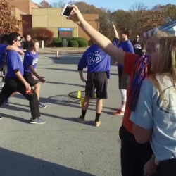 Photo of a group of students holding poses for a Mannequin Challenge