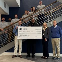 TVA leaders present ChattState President Dr. Rebecca Ashford with a $10,000 donation while flanked by nuclear science and radiation protection students.