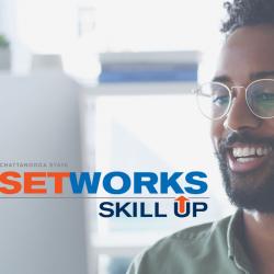 man at computer, setworks logo