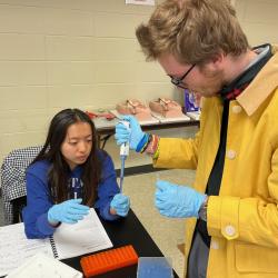 Two students practice extracting DNA in a lab at ChattState.