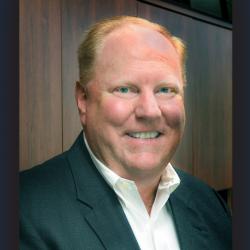 headshot of man in suit