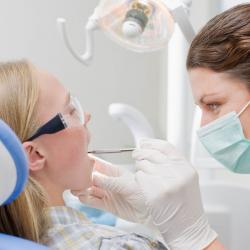 child with dental hygienist