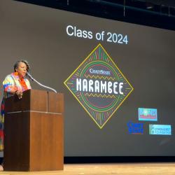 Kisha Thomas, Director of Recruiting & Orientation, speaks during the Harambee ceremony.