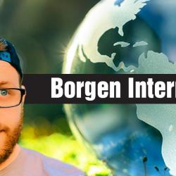 jake bolden looking at a world globe in a forest with the words borgen internship
