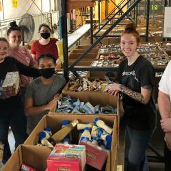 grouo of students inside food bank