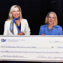 2 women holding an oversize check