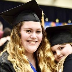 woman and girl in graduation caps