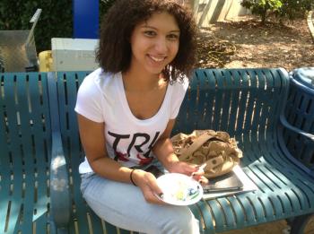 Tn Promise student enjoys a piece of 50th Birthday cake for the college