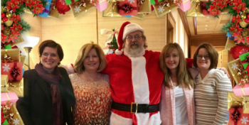 Photo of employees Nancy Patterson, Tammy Sawyers Chef Stan as Santa, Suzanne Harris and Brenda Ingram for a holiday themed image