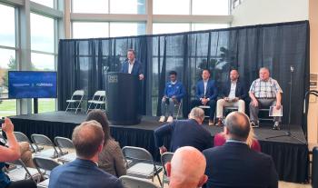 A panel of speakers sits on a stage during the 10,000 Tennessee Promise students event at ChattState.