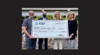 4 people holding poster size check