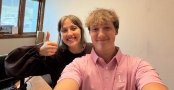 A selfie of a young man and women
