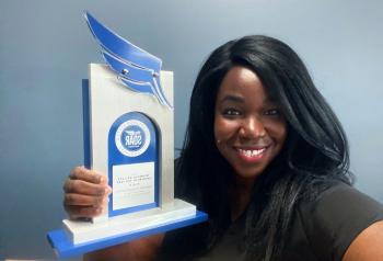 Amanda Sovago-Royal holds her SOAR Award. Amanda Sovago-Royal holds her SOAR Award.