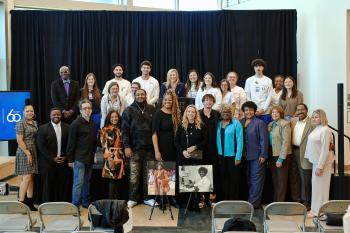 ChattState employees & nursing students stand with photos of Ernestine Carter.