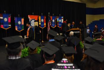 Students in regalia face the stage during ChattState's Spring 2022 graduation.