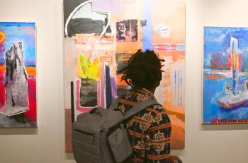 A student looks at a piece of art in the Denise Heinly art center on Chattanooga State's campus.