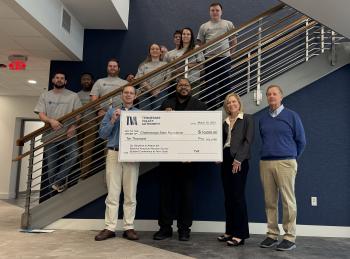 TVA leaders present ChattState President Dr. Rebecca Ashford with a $10,000 donation while flanked by nuclear science and radiation protection students.