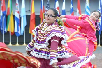 A woman dancing in a traditional dress.