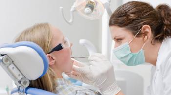 child with dental hygienist