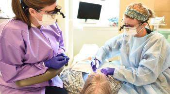 faculty members supervising dental hygiene student