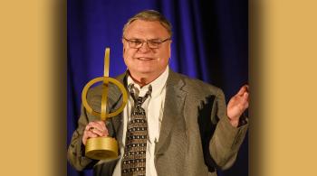 man holding an award