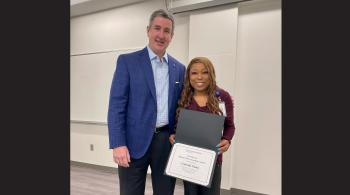 man presenting a certificate to woman