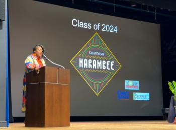 Kisha Thomas, Director of Recruiting & Orientation, speaks during the Harambee ceremony.