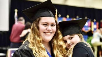 woman and girl in graduation caps