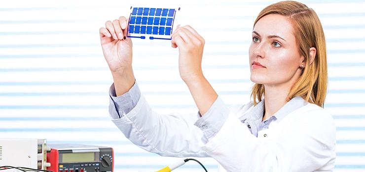 Technician observes an electronic part