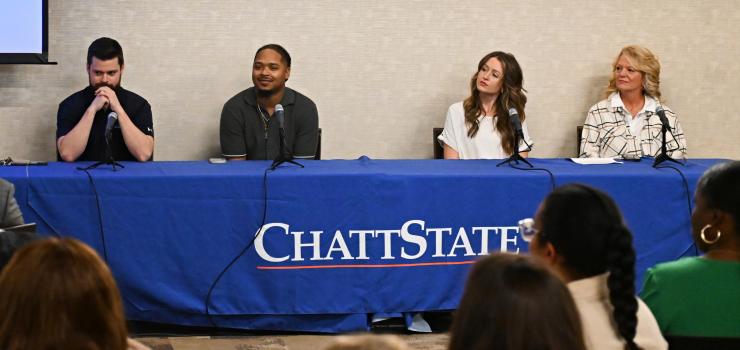 Gary Satin, Jamaal Lundy, Brooke Hale, and Carla Frizzel sit in front of microphones at a table with a ChattState table cloth.