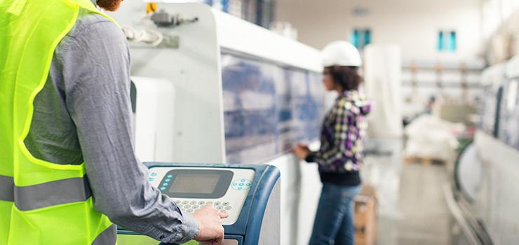 sparks fly as robotic arm weld machine parts